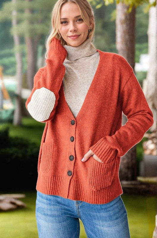 Full size long sleeve V-neck button down cardigan with ribbed details and pockets.