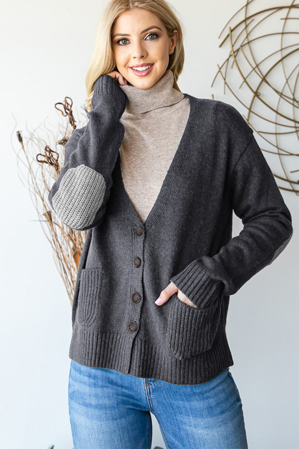 Full size long sleeve V-neck button down cardigan with pockets and ribbed details.