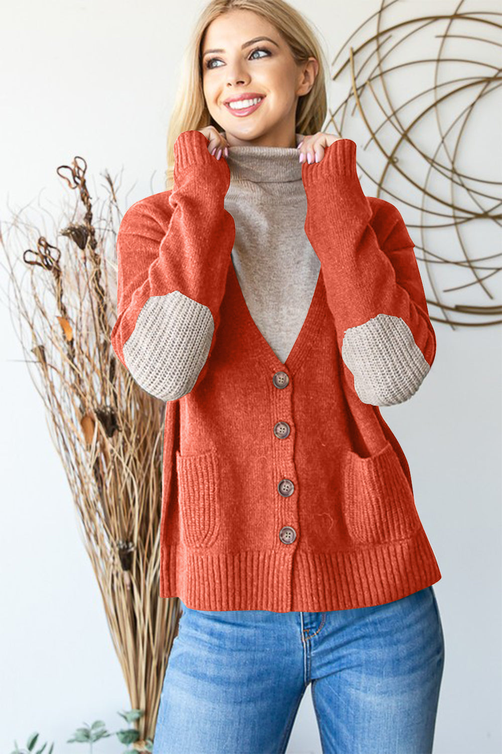 Full size long sleeve V-neck button down cardigan with ribbed details and pockets.