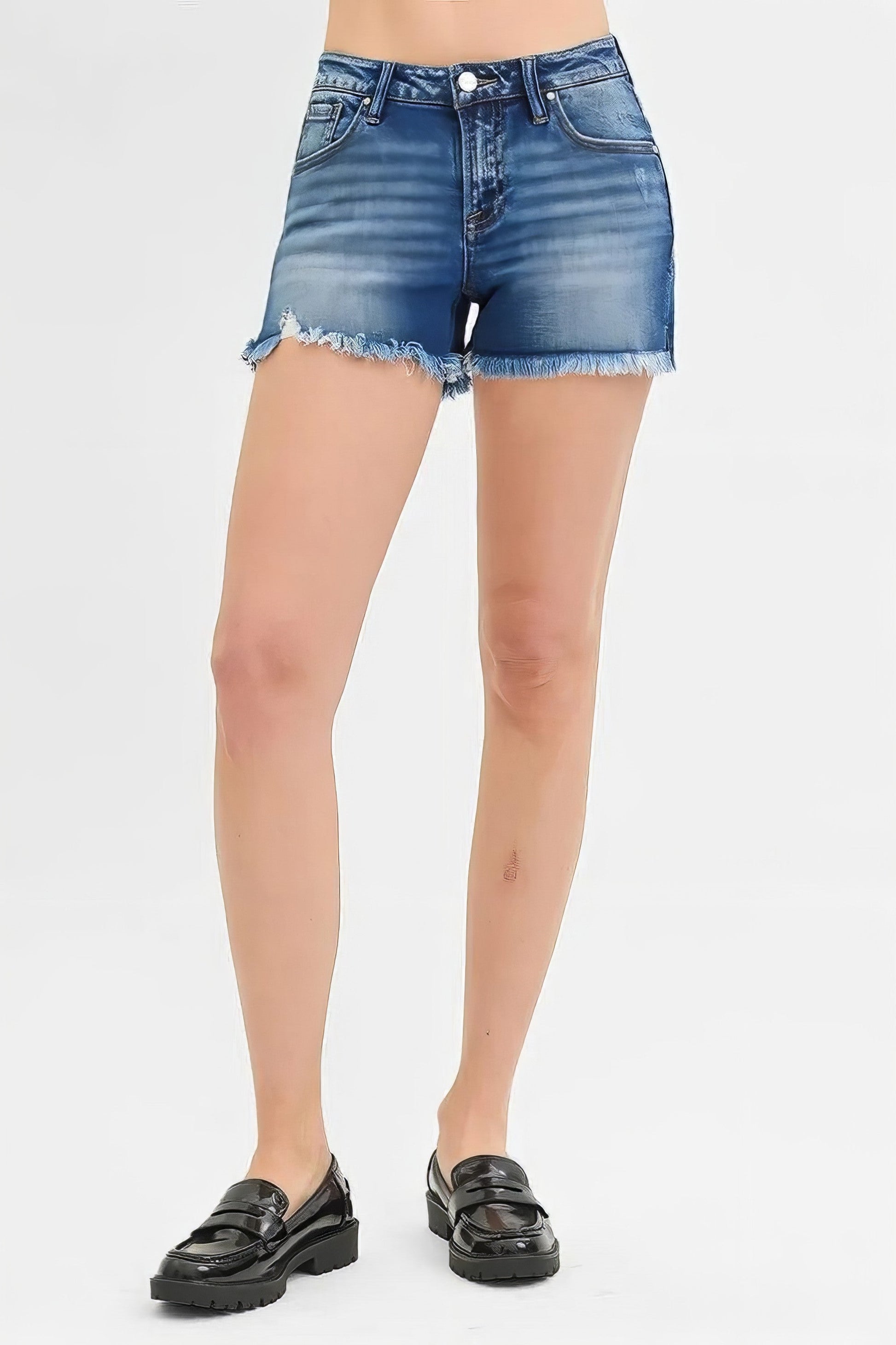 Plus size low rise frayed denim shorts with distressed details.