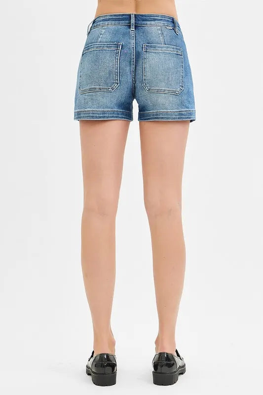 High-waist denim shorts with buttons and pockets.