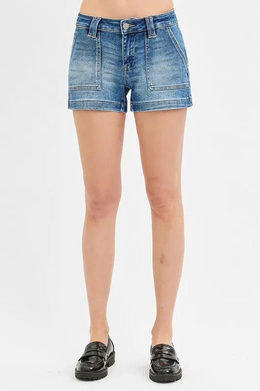 High-waist denim shorts with buttons and pockets.