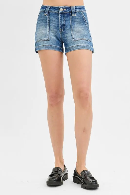 High-waist denim shorts with buttons and pockets.