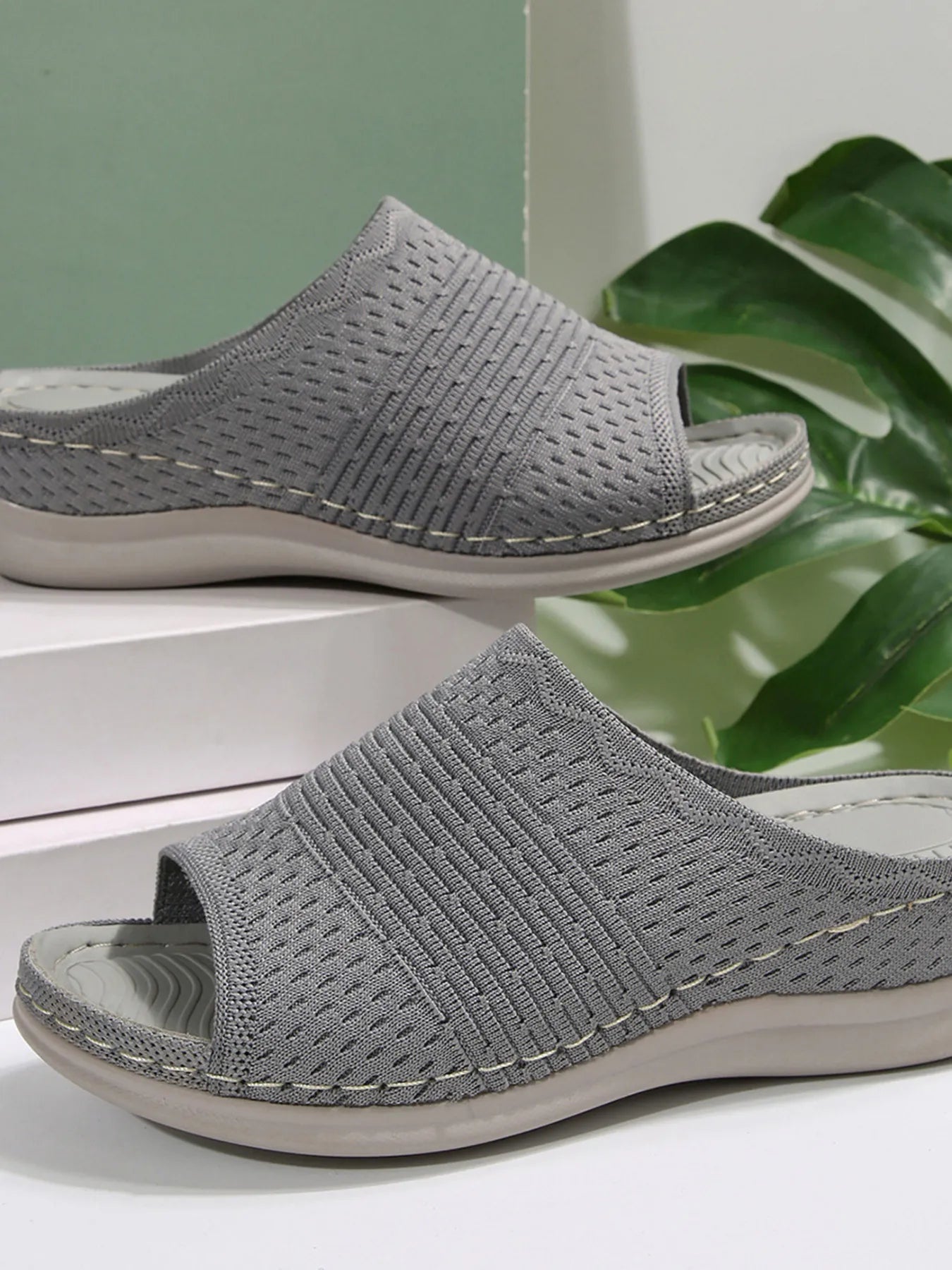 Breathable mesh open toe flat sandals.