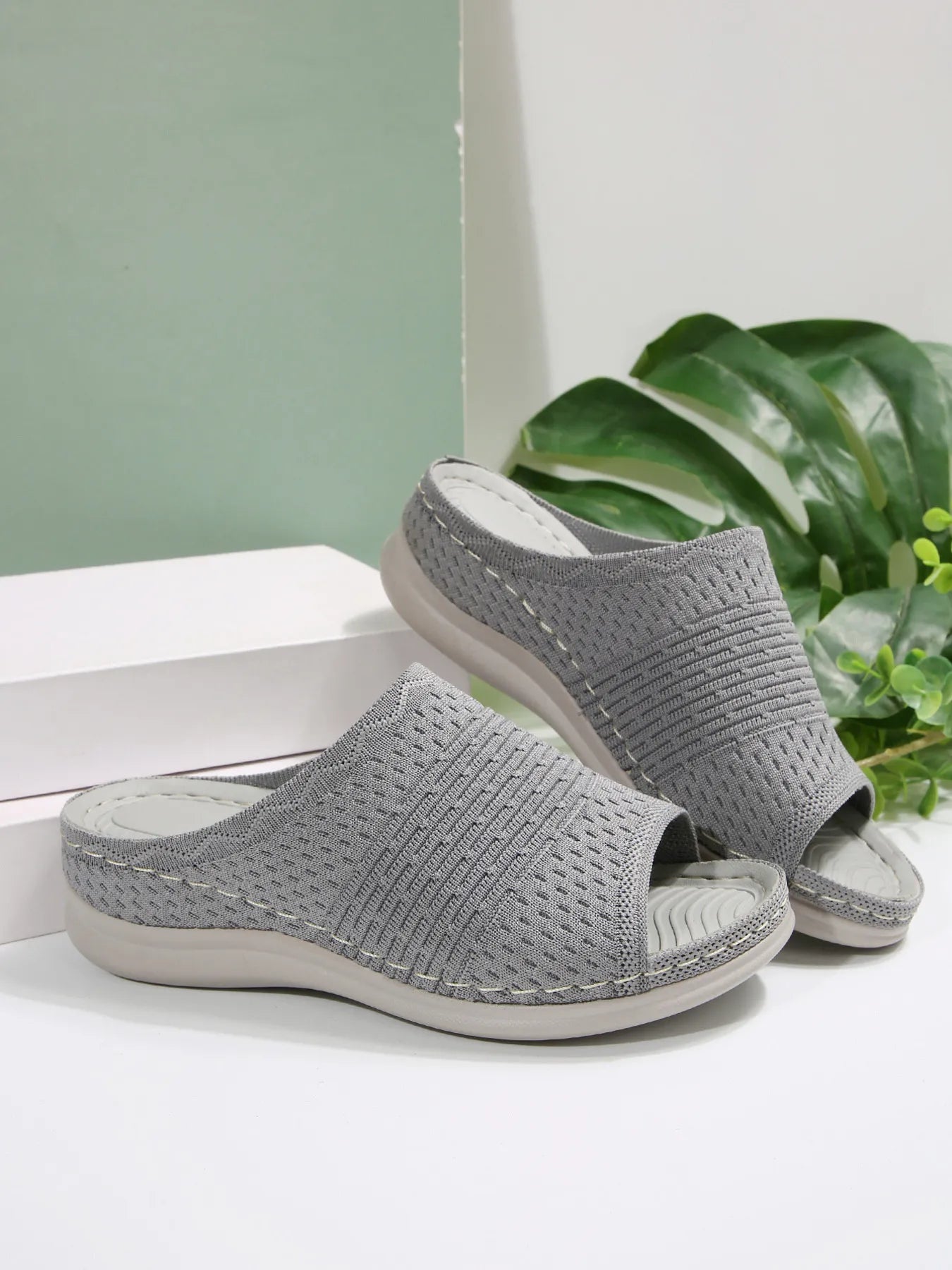 Breathable mesh open toe flat sandals.