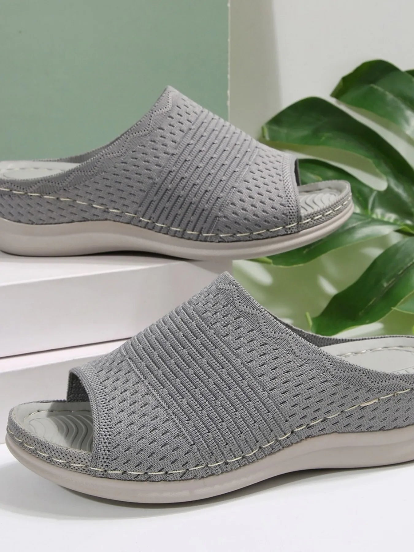 Breathable mesh open toe flat sandals.