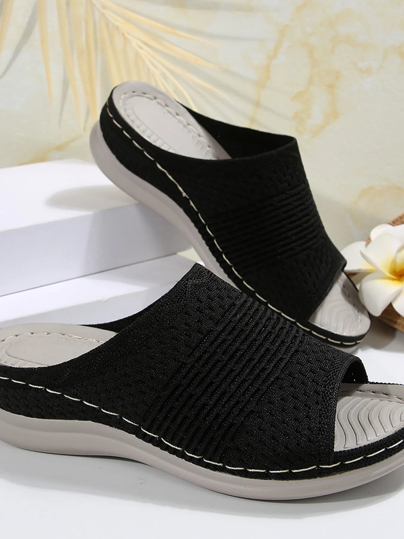 Breathable mesh open toe flat sandals.