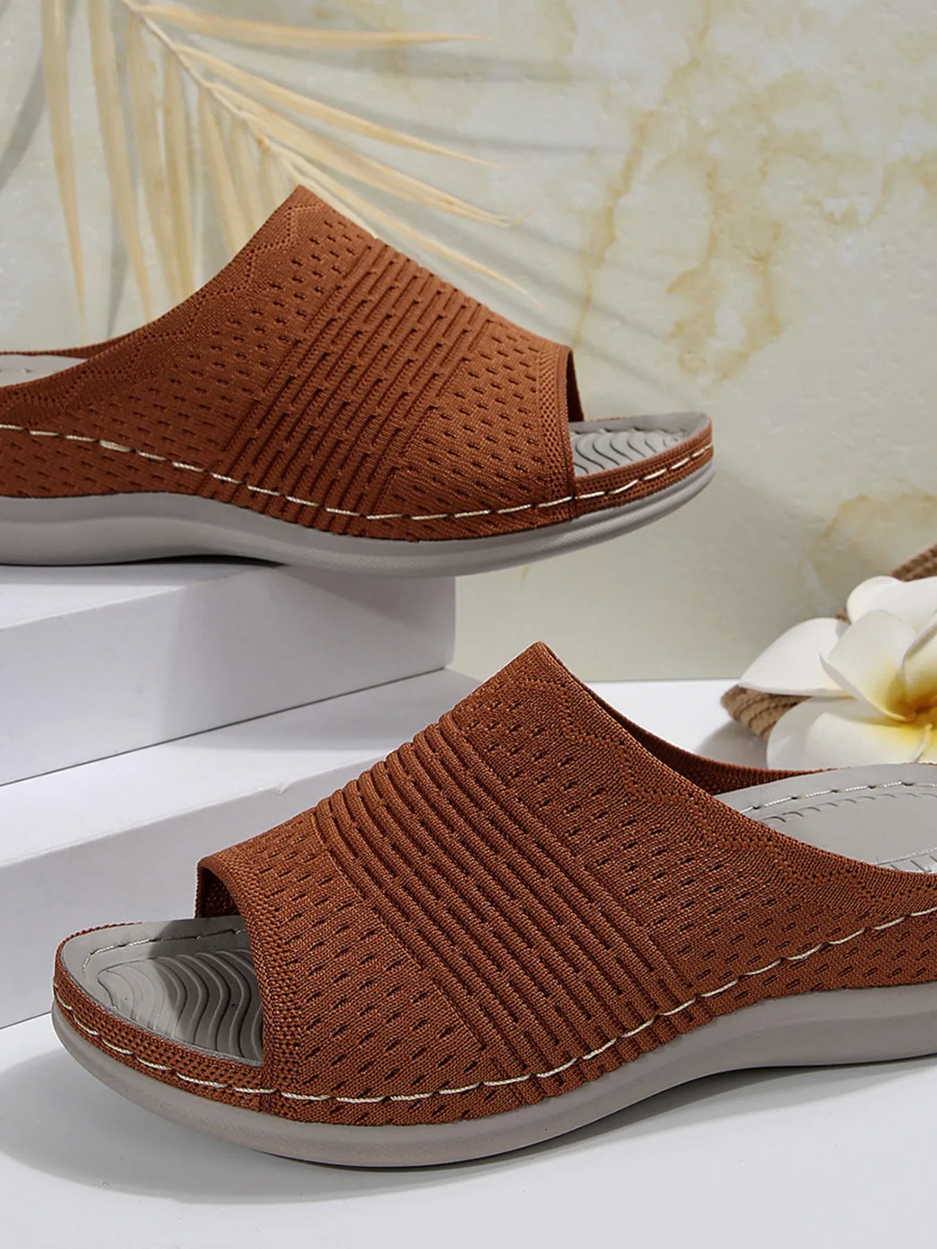 Breathable mesh open toe flat sandals.