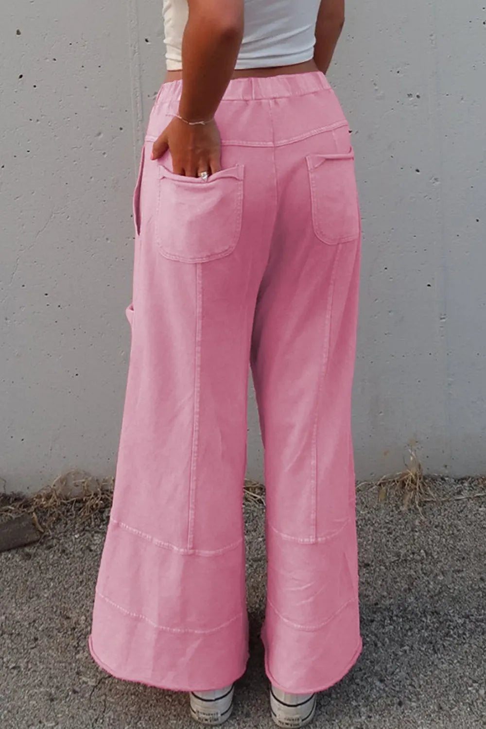 Mineral wash exposed seam drawstring high waist wide leg cargo pants with pockets.