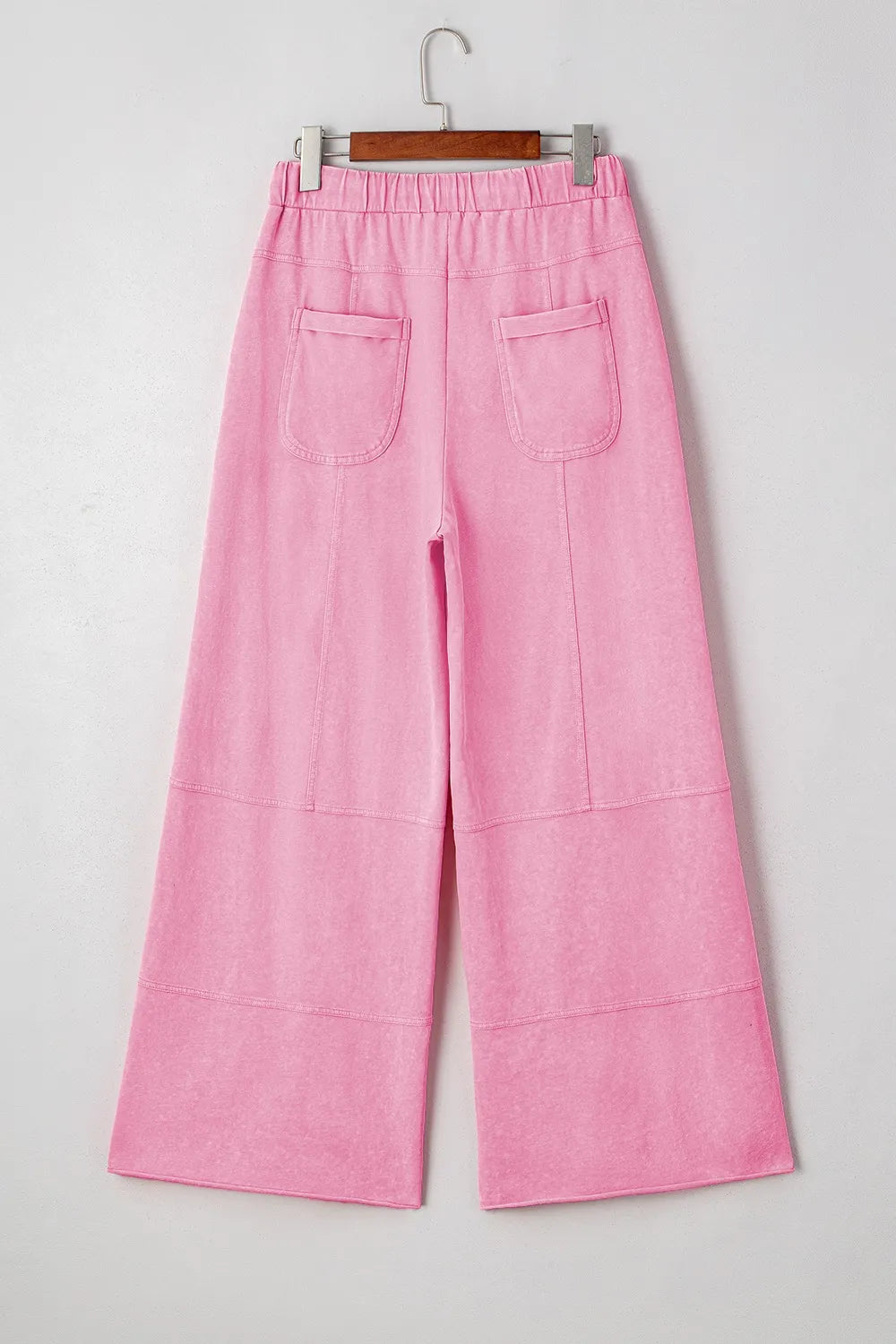 Mineral wash exposed seam drawstring high waist wide leg cargo pants with pockets.