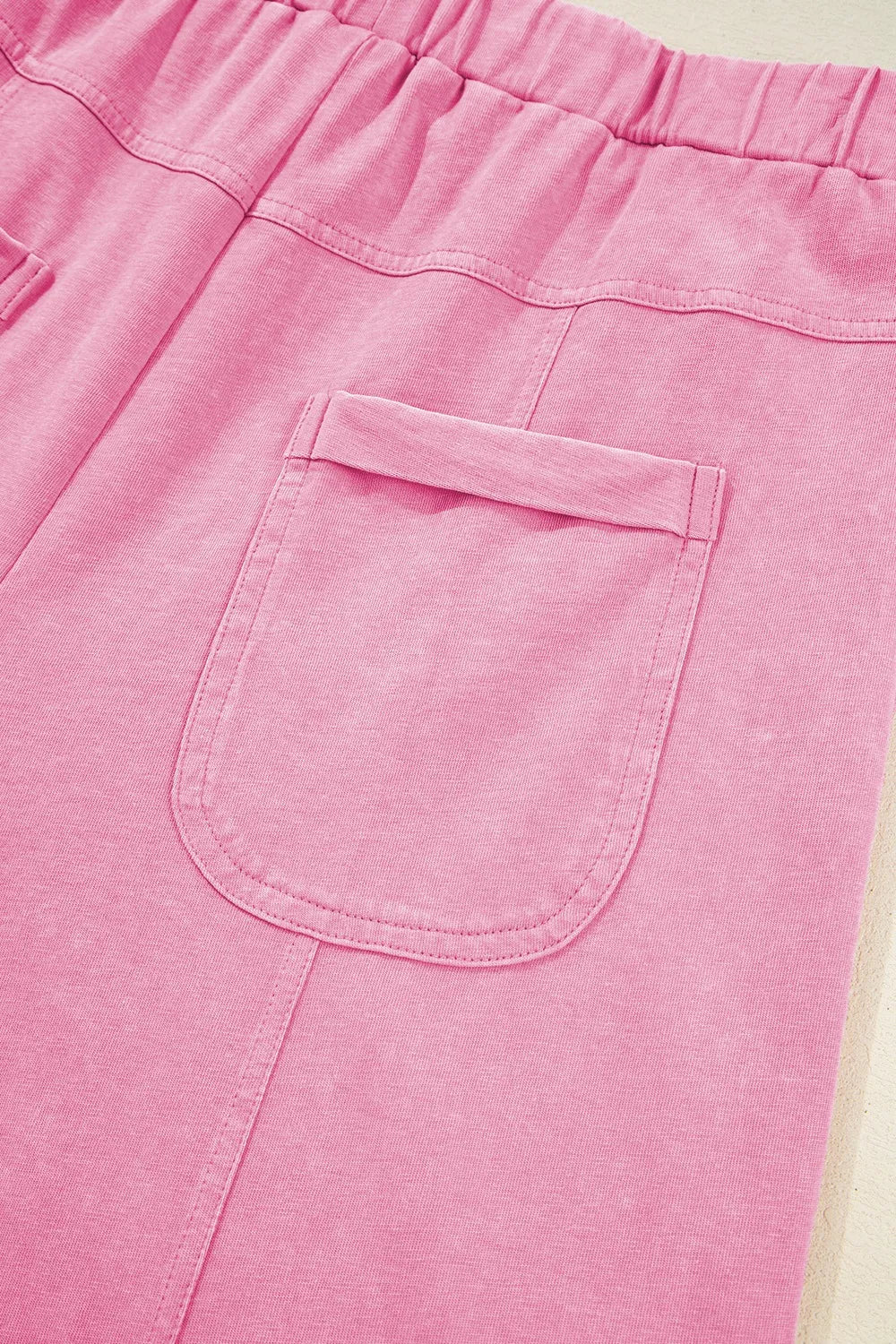 Mineral wash exposed seam drawstring high waist wide leg cargo pants with pockets.