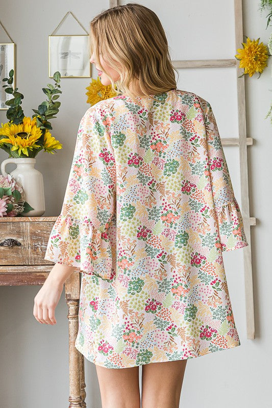 Plus size multi-color floral open cardigan with ruffled thin fabric.