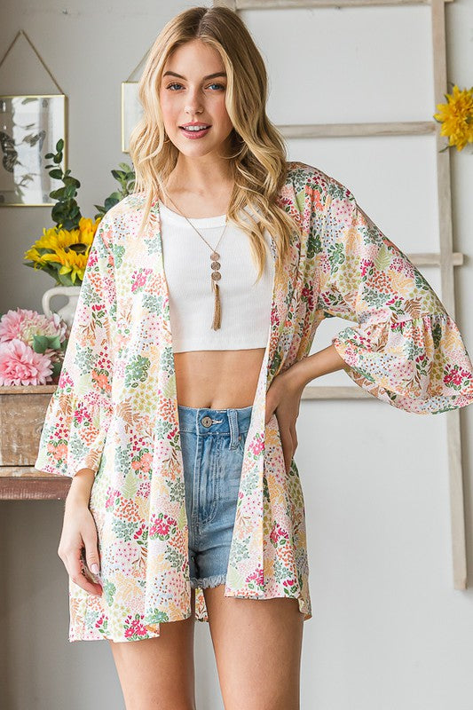Plus size multi-color floral open cardigan with ruffled thin fabric.