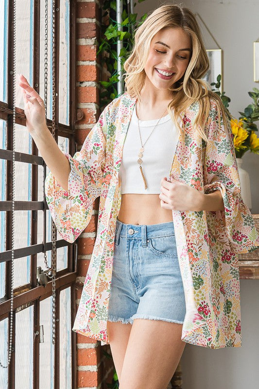Plus size multi-color floral open cardigan with ruffled thin fabric.