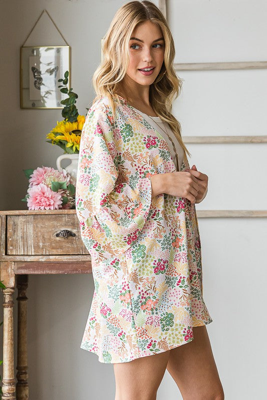 Plus size multi-color floral open cardigan with ruffled thin fabric.