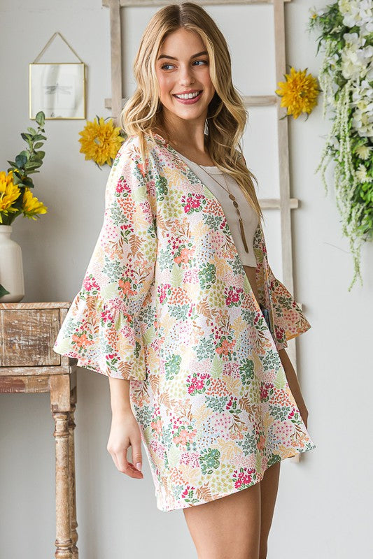 Plus size multi-color floral open cardigan with ruffled thin fabric.