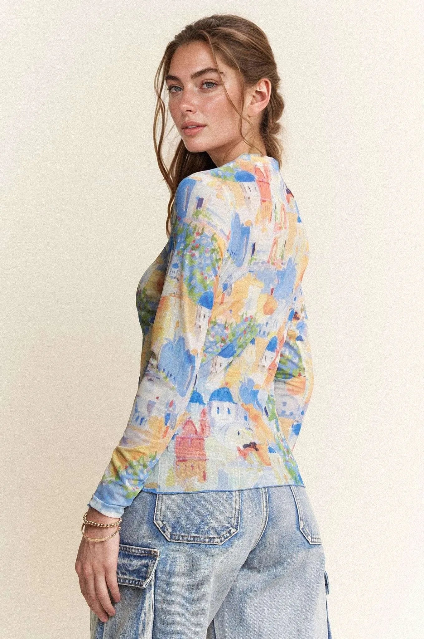 Davi Dani Multi Printed Mesh Round Neck Long Sleeve Top.