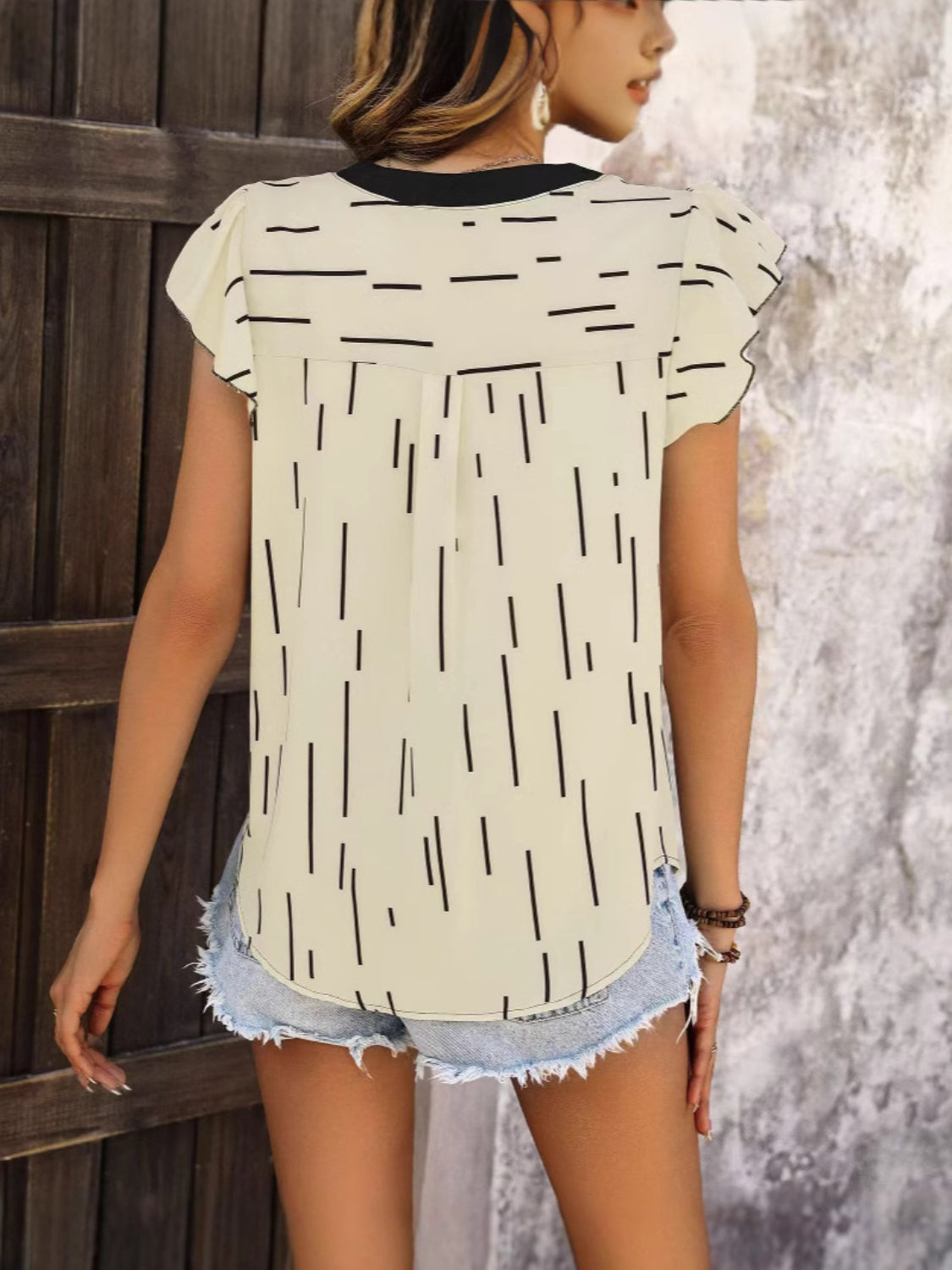 Notched Ruffled Cap Sleeve Blouse.