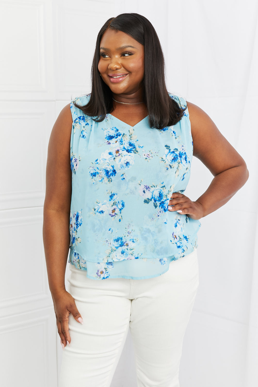 Full size floral tank top with V-neck and layered high-low hem, sheer.