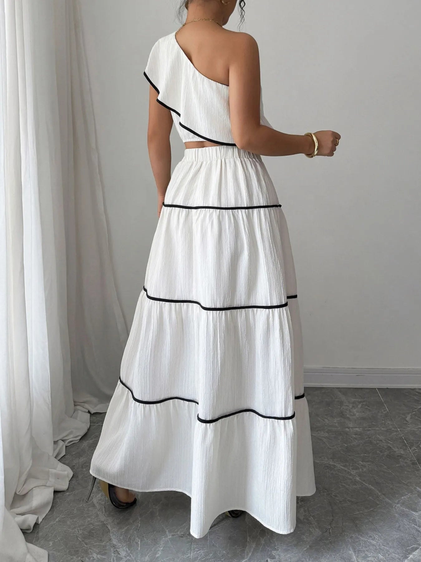 One-Shoulder Ruffle Top and Skirt Two-Piece Set.