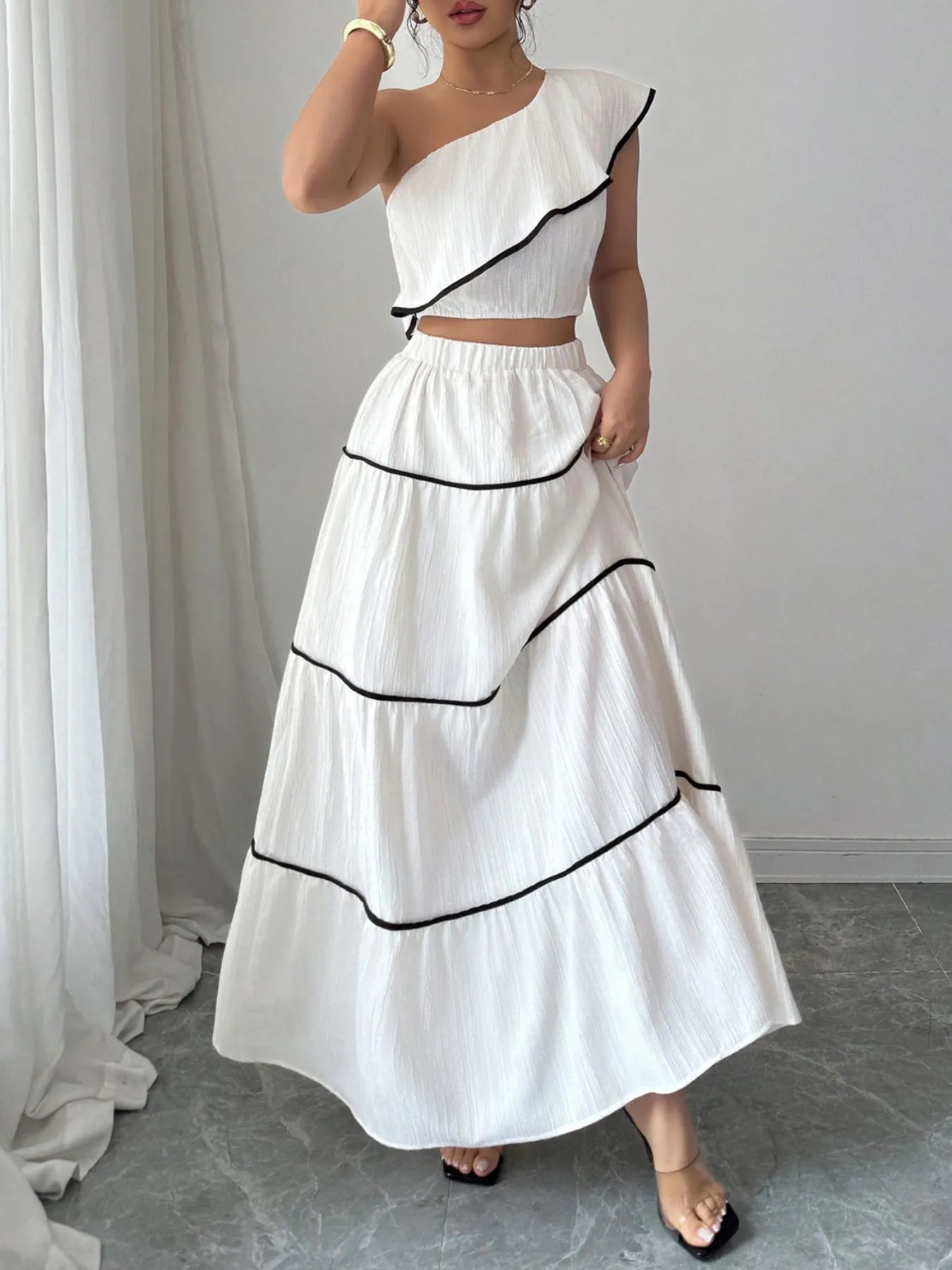 One-Shoulder Ruffle Top and Skirt Two-Piece Set.