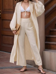 Two-piece set: open front balloon sleeve cardigan and matching pants.