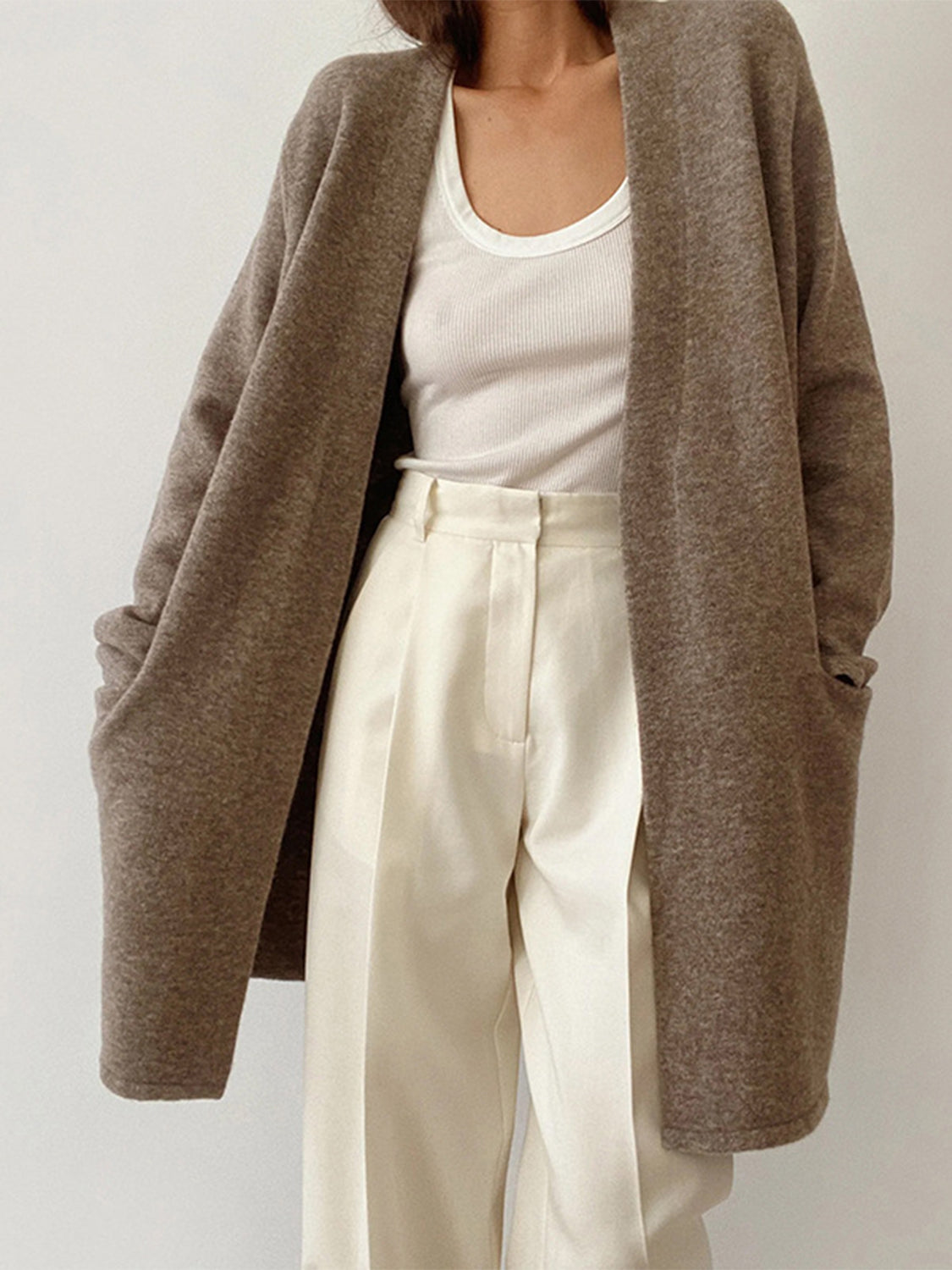 Open front long sleeve cardigan with pockets.