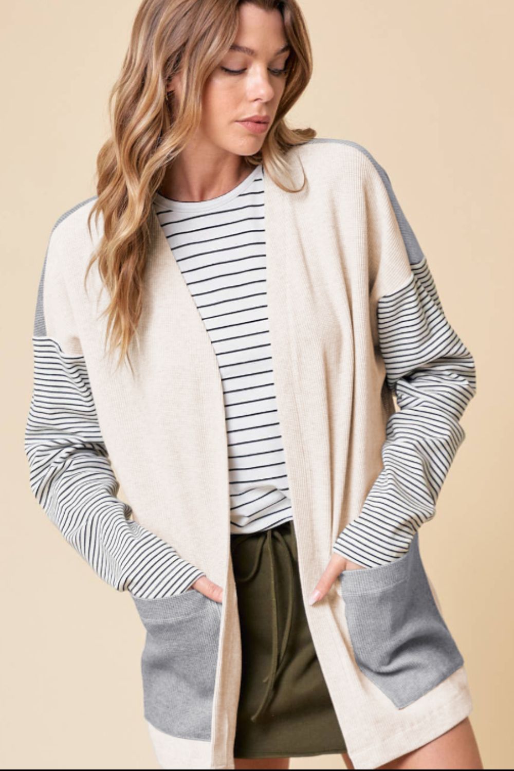 Open front long sleeve striped cardigan with pockets.