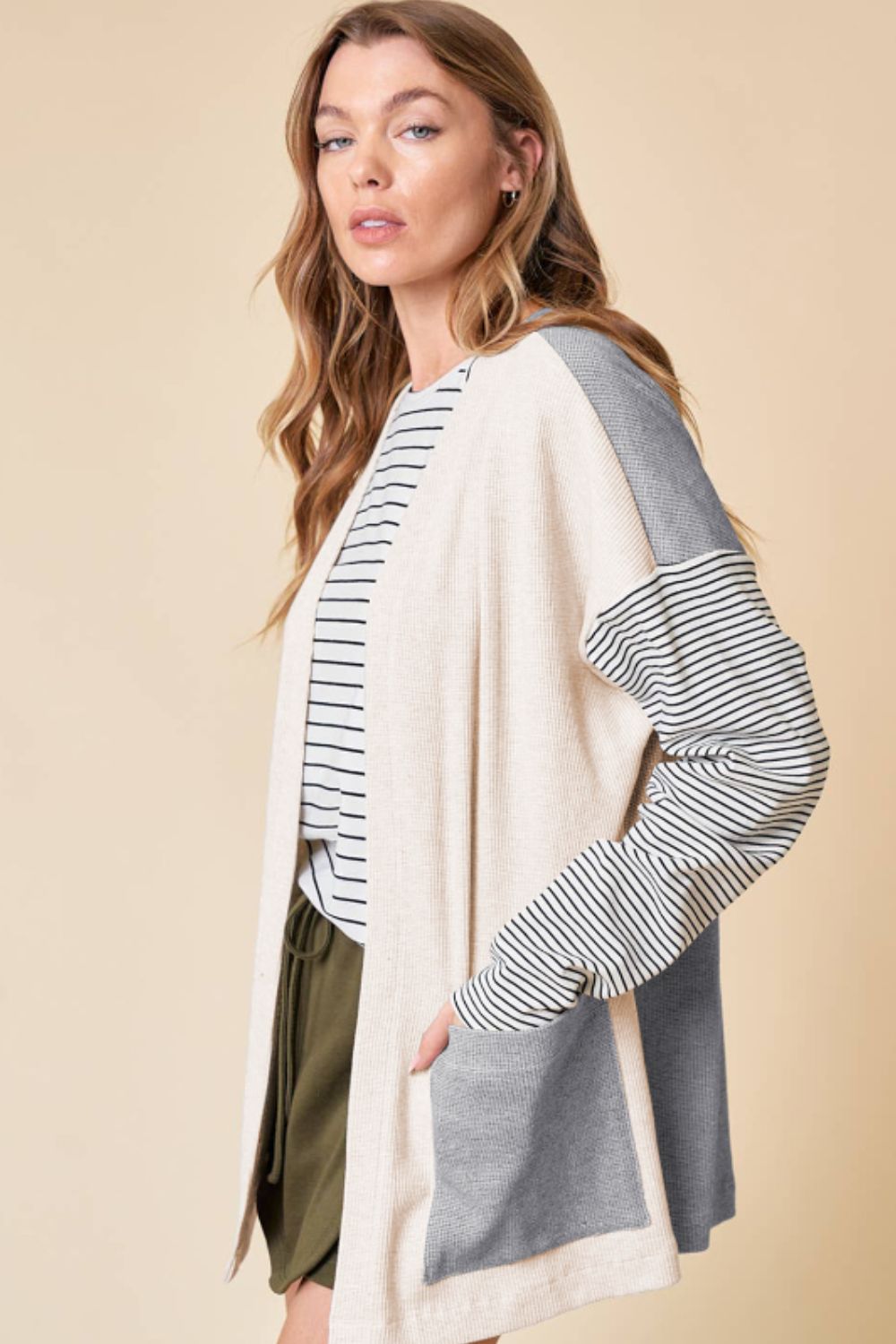 Open front long sleeve striped cardigan with pockets.