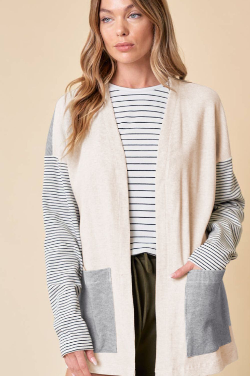 Open front long sleeve striped cardigan with pockets.