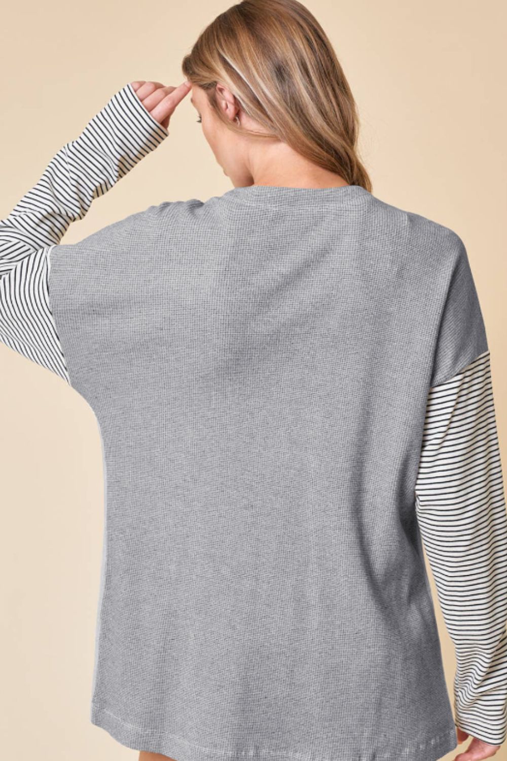 Open front long sleeve striped cardigan with pockets.
