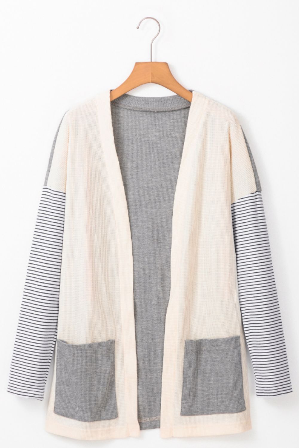 Open front long sleeve striped cardigan with pockets.