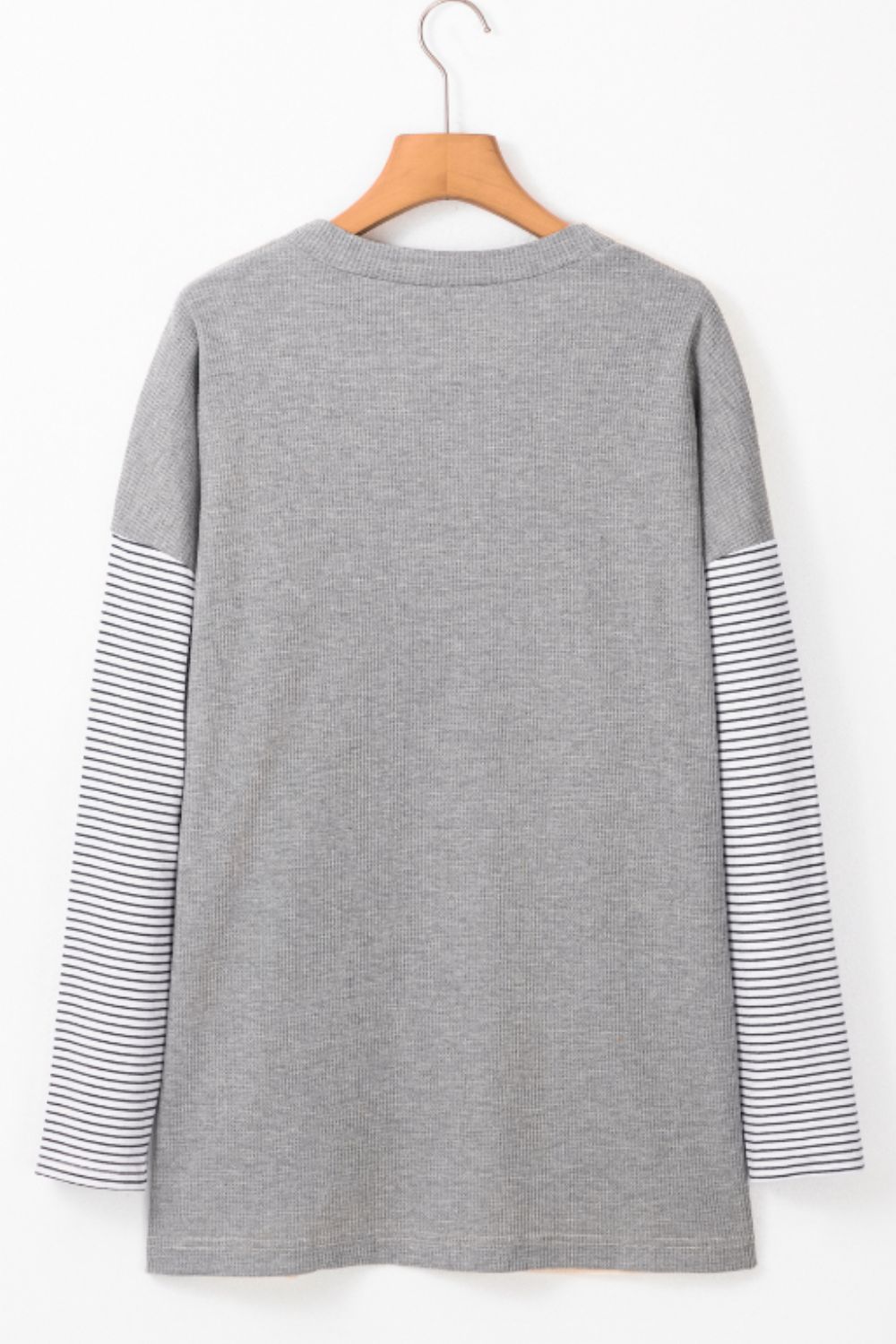 Open front long sleeve striped cardigan with pockets.