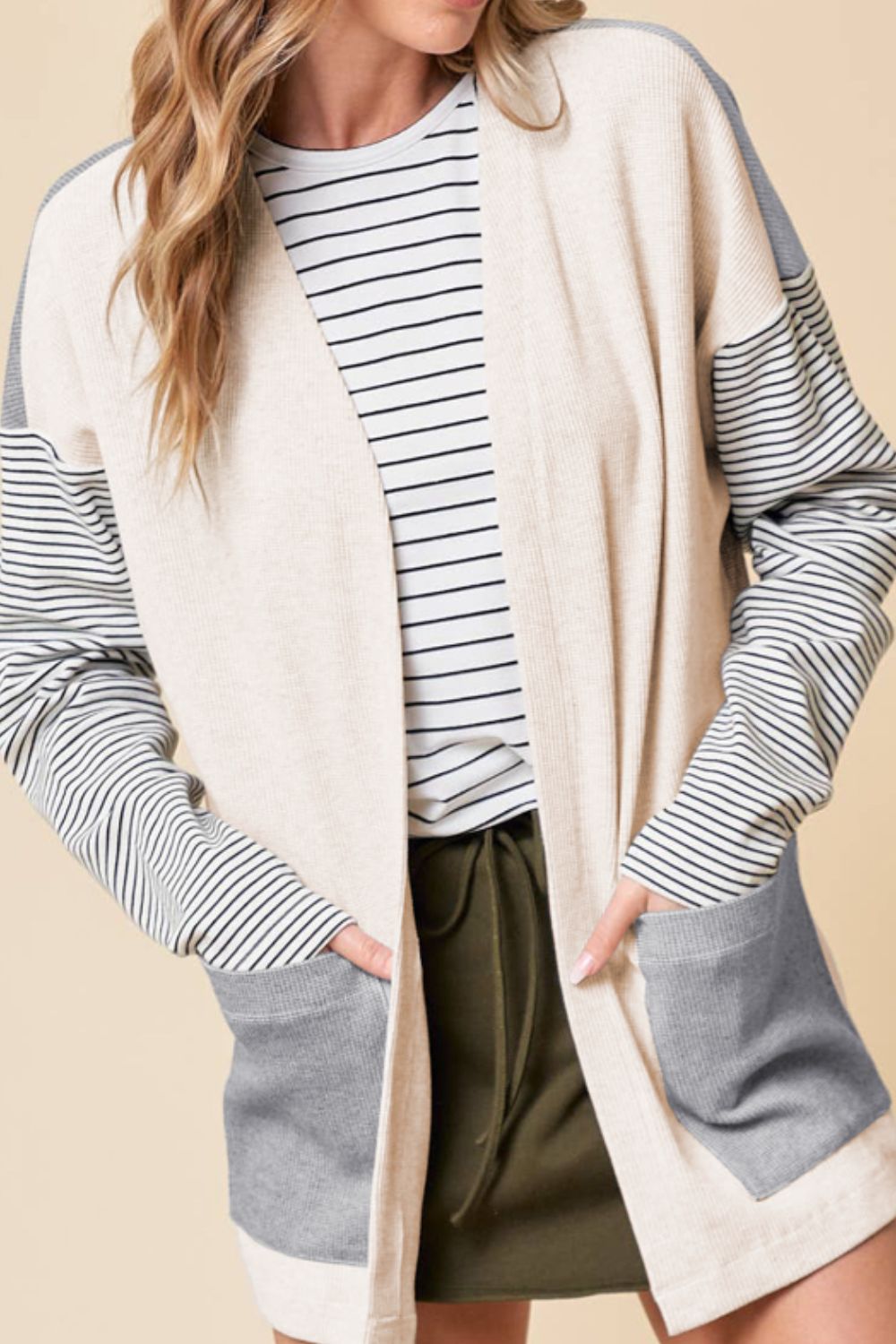 Open front long sleeve striped cardigan with pockets.