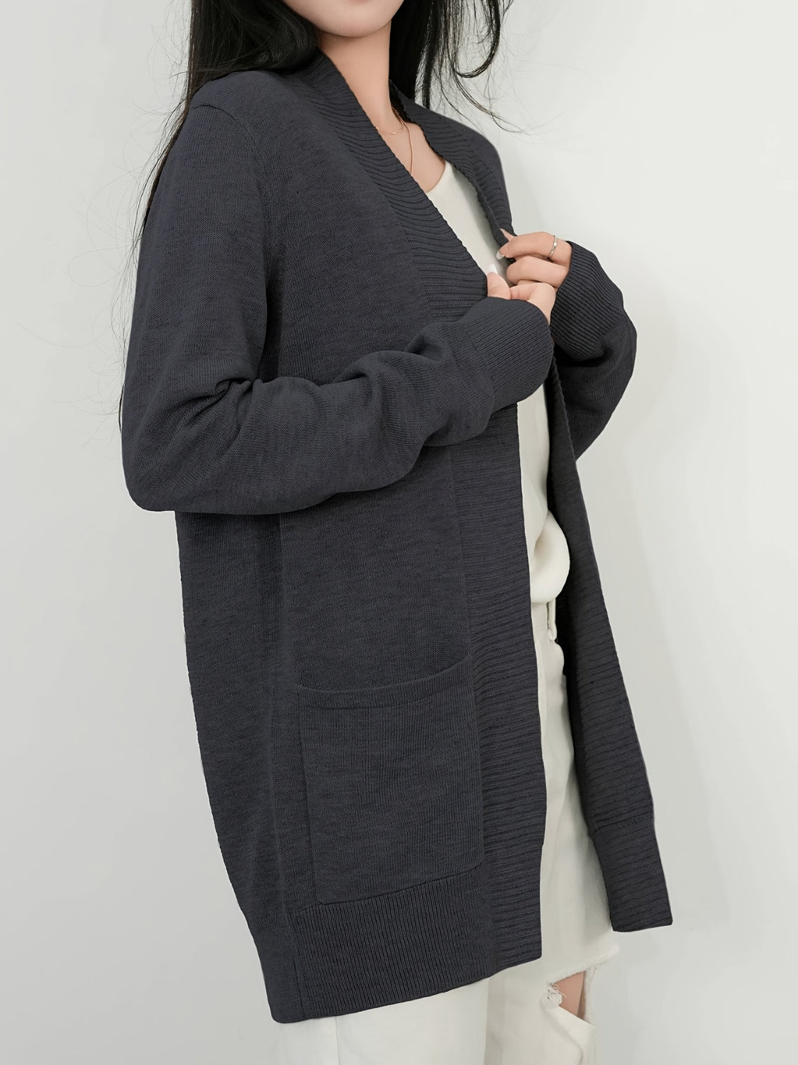 Open front long sleeve sweater cardigan with pockets.
