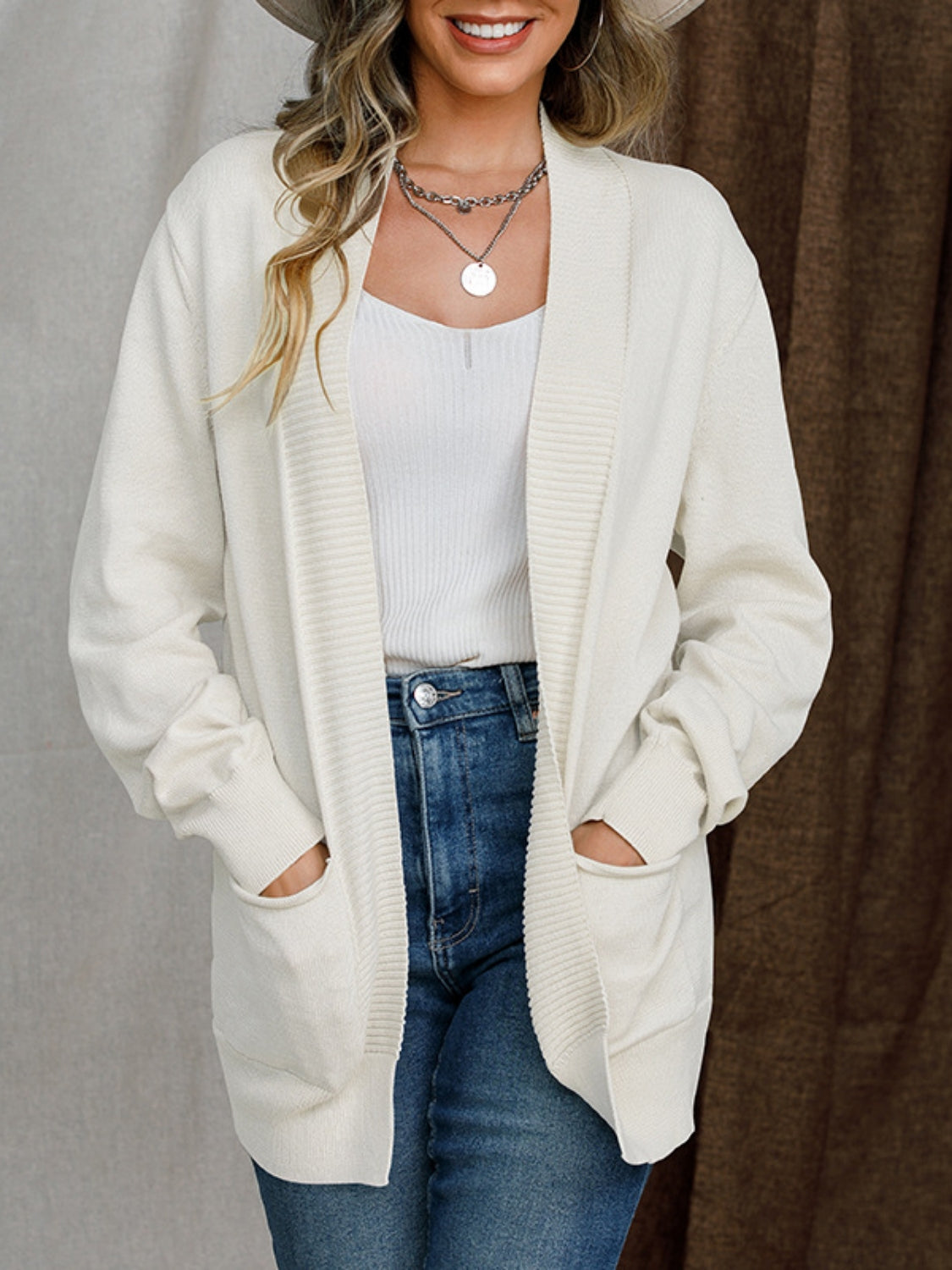 Open front long sleeve sweater cardigan with pockets.