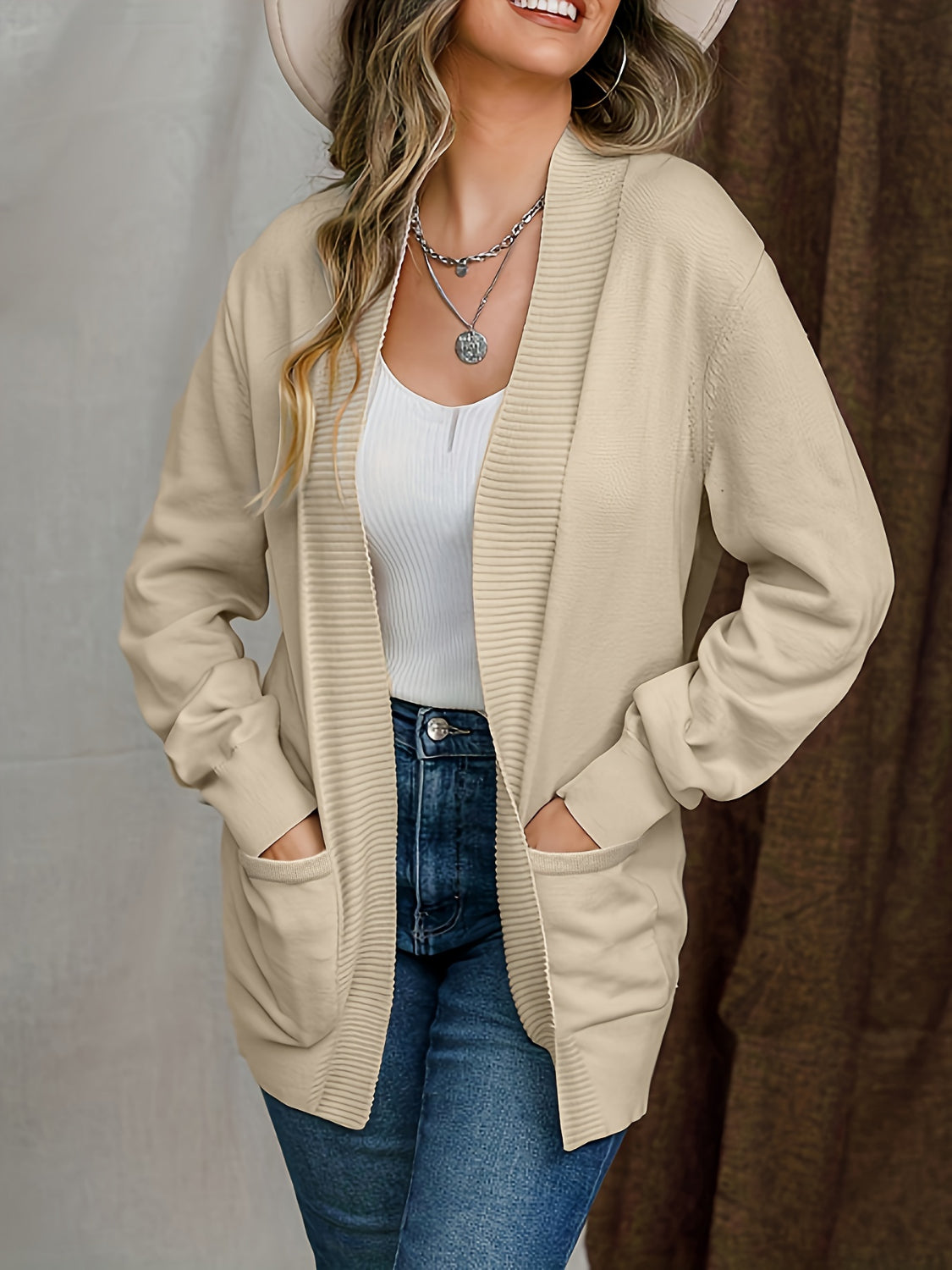 Open front long sleeve sweater cardigan with pockets.
