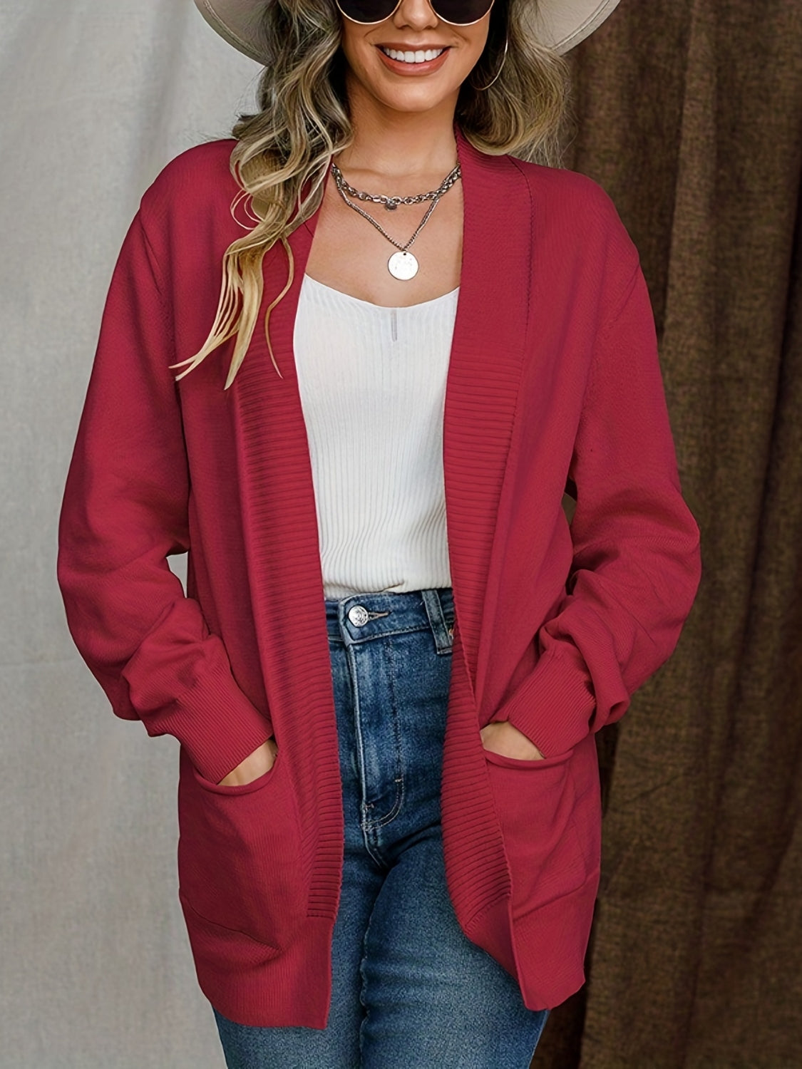 Open front long sleeve sweater cardigan with pockets.