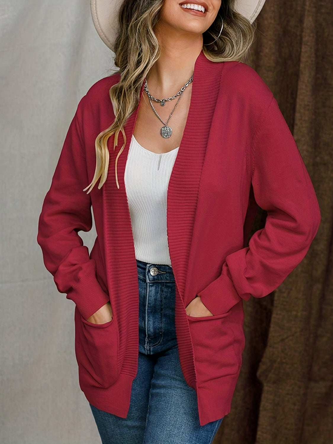 Open front long sleeve sweater cardigan with pockets.