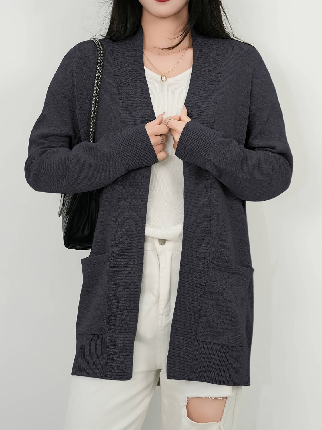 Open front long sleeve sweater cardigan with pockets.