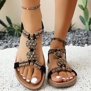 Open toe flat sandals.