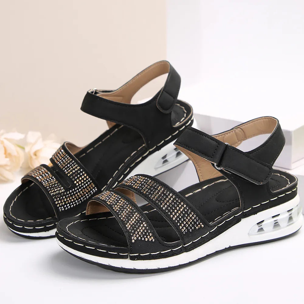 Open toe inlaid rhinestone low heel wedge sandals.