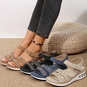 Open toe inlaid rhinestone low heel wedge sandals.