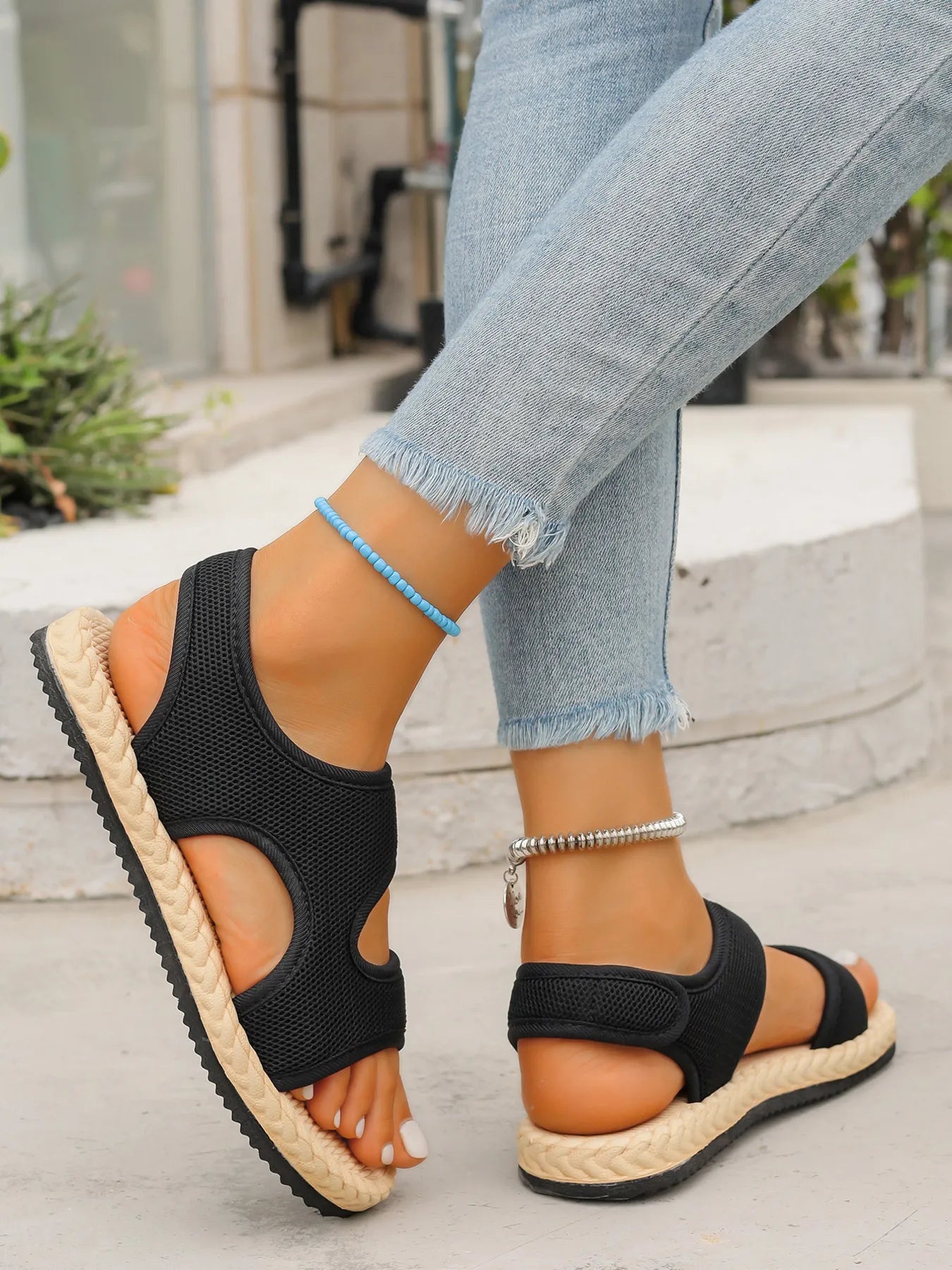 Open toe mesh flat sandals.