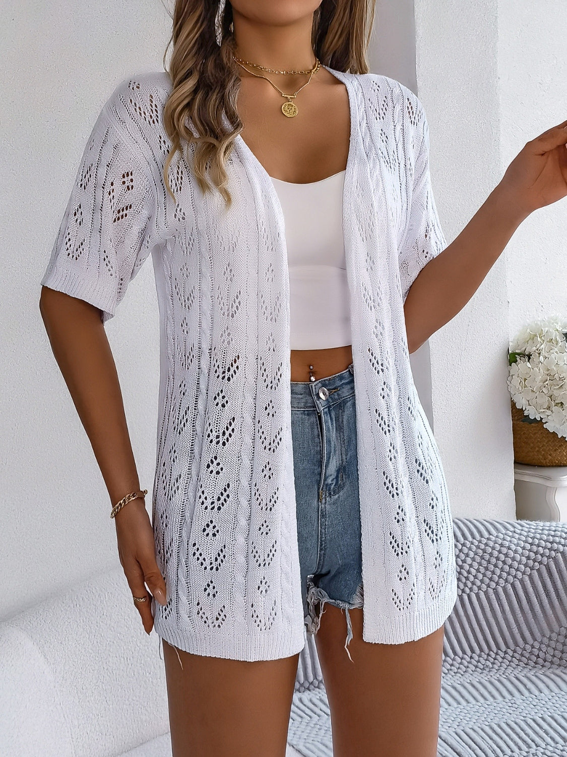 Openwork open front half sleeve cardigan.