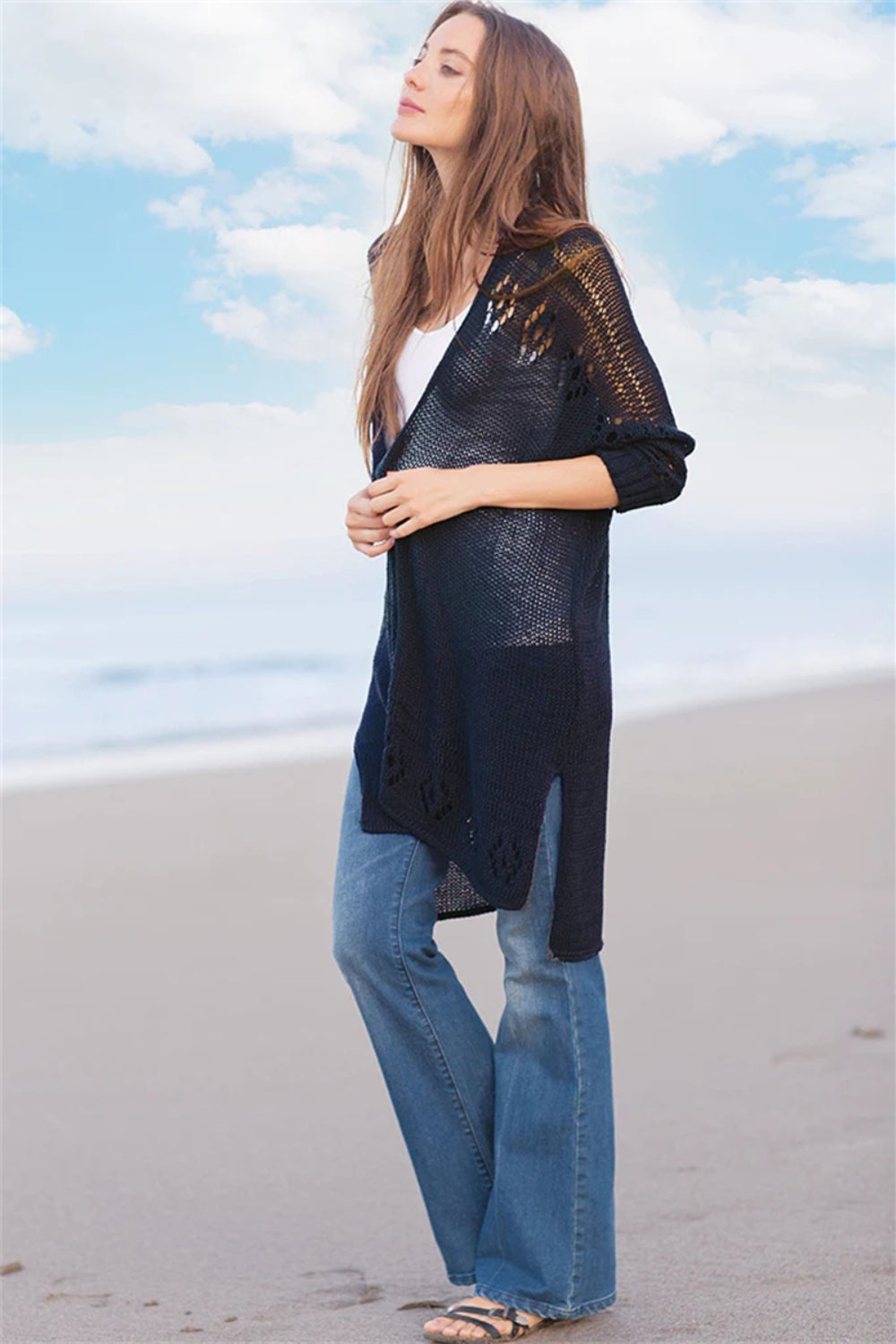 Openwork side slit open front long sleeve cardigan with cutout details.