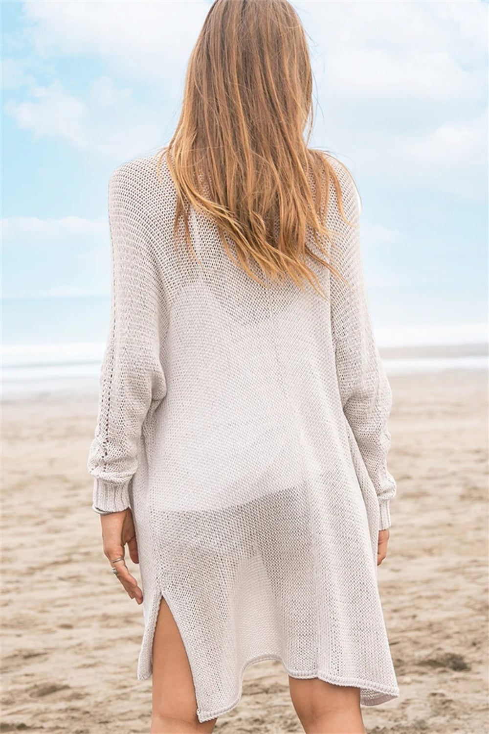 Openwork side slit open front long sleeve cardigan with cutout details.