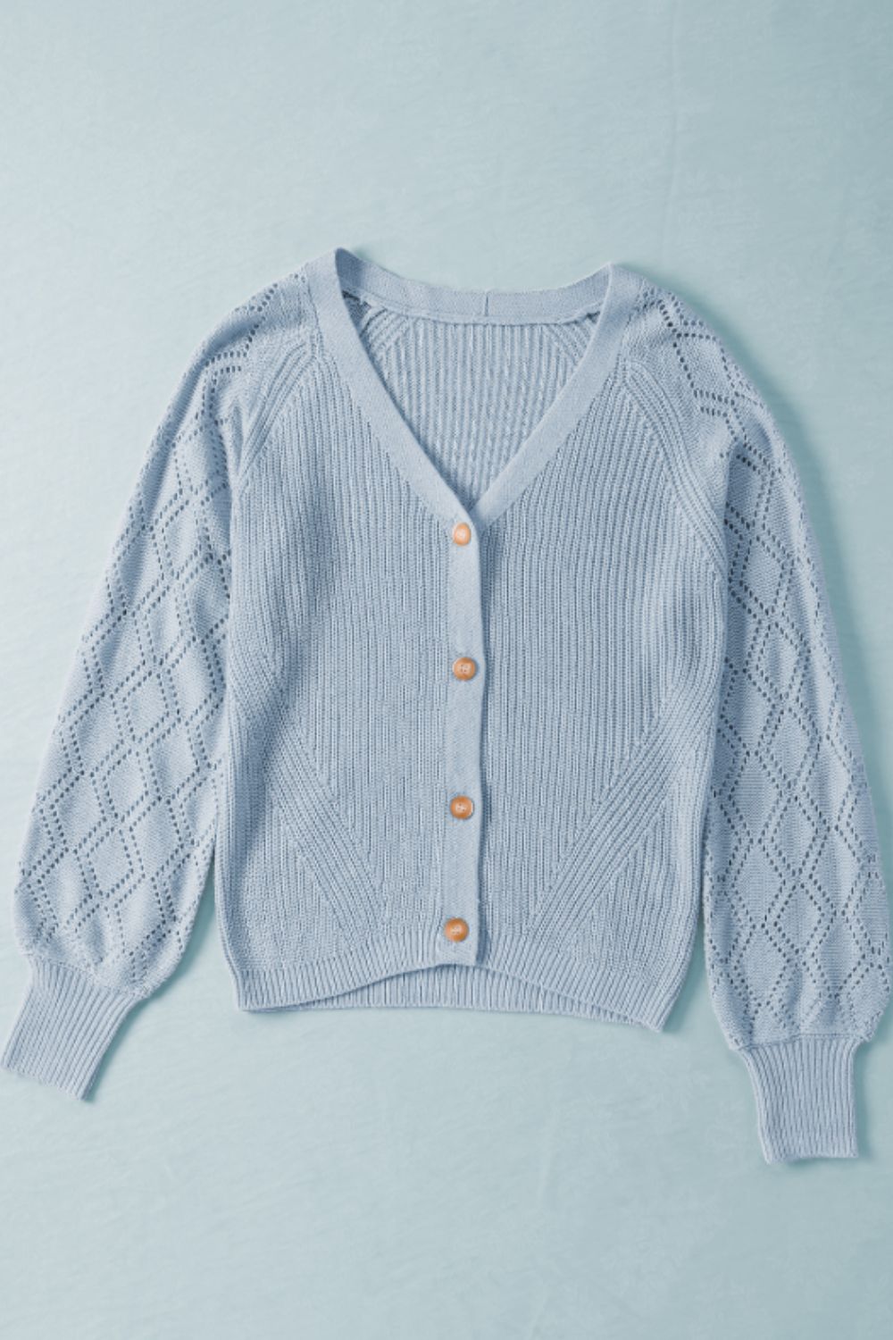 Openwork V-neck button up cardigan.