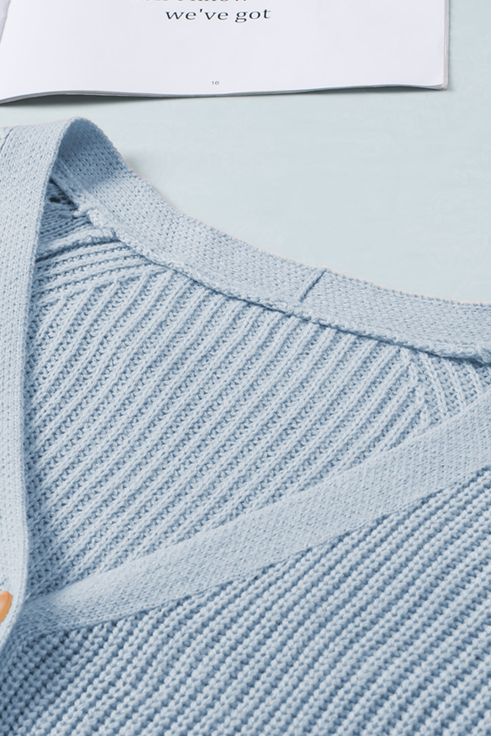 Openwork V-neck button up cardigan.