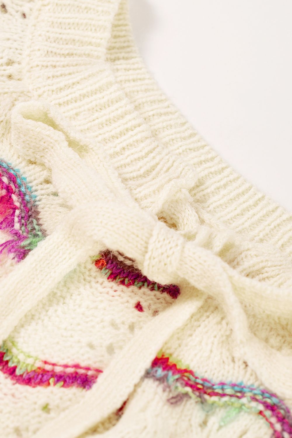 Openwork Wavy Striped Round Neck Sweater with Tied Detail.